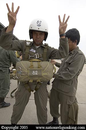 Border Patrol Police: Member of the Royal Thai Police preparing for a static line jump. Hua Hin, Thailand.