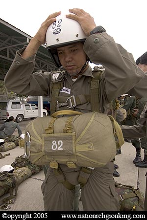 Border Patrol Police: Member of the Royal Thai Police preparing for a static line jump. Hua Hin, Thailand.